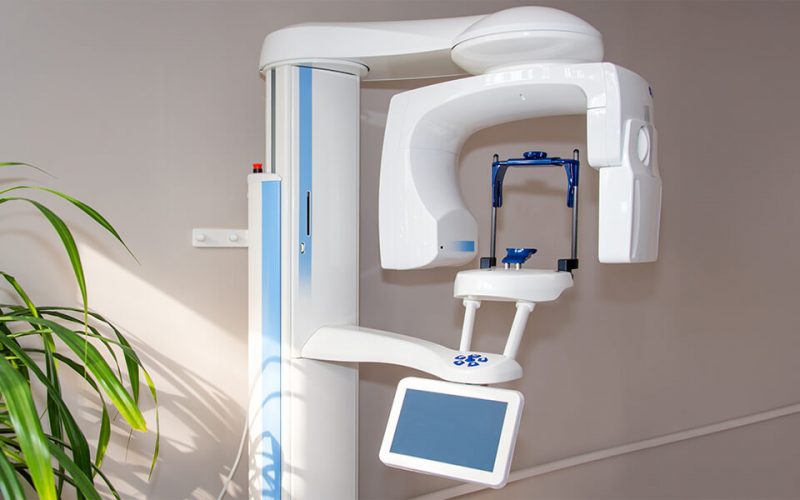 a Planmeca ProMax 3D imaging unit, often used in dental clinics for advanced diagnostics.